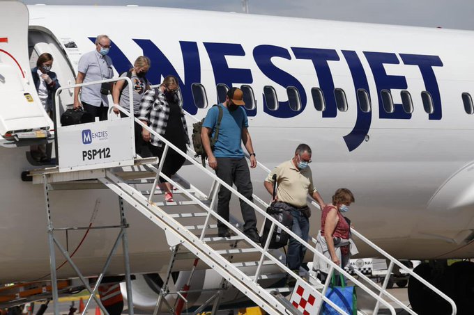 deplaning via stairs at airport in Mazatlán, Sinaloa, Mexico
